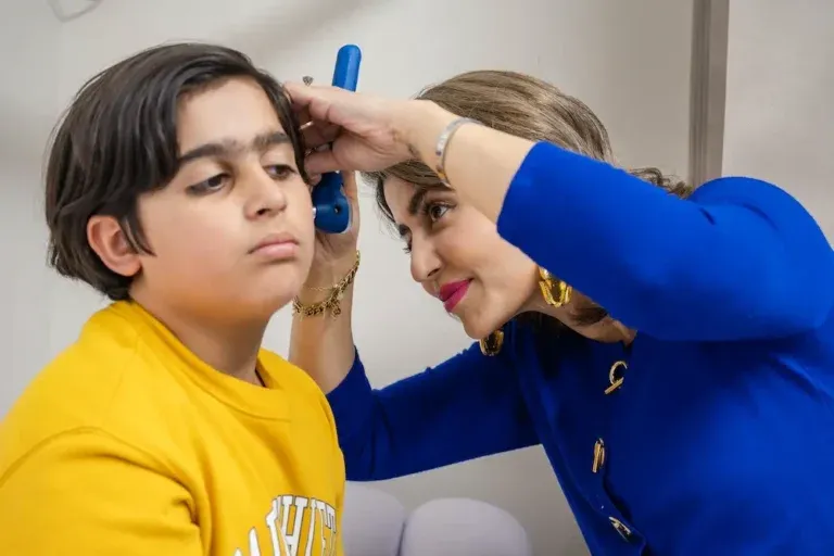 Dr Anita Raja consulting a patient